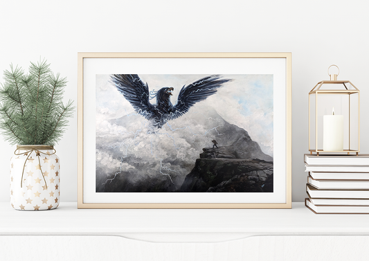 A framed painting print titled 'Pamola Peak' depicting the pamola in flight with a mountainous background, displayed on a wall shelf.
