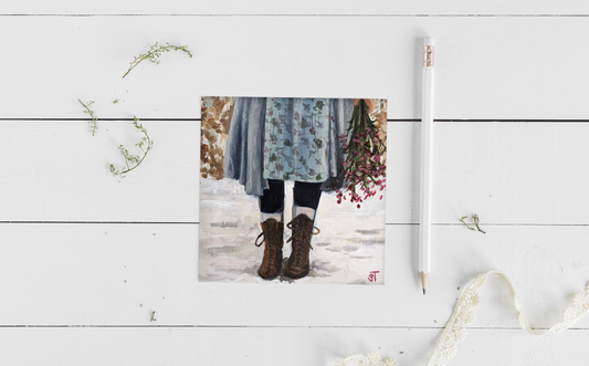 Winter Boots Mainecore Greeting Card, laid flat on white surface with decorative elements including lace and a white pencil.