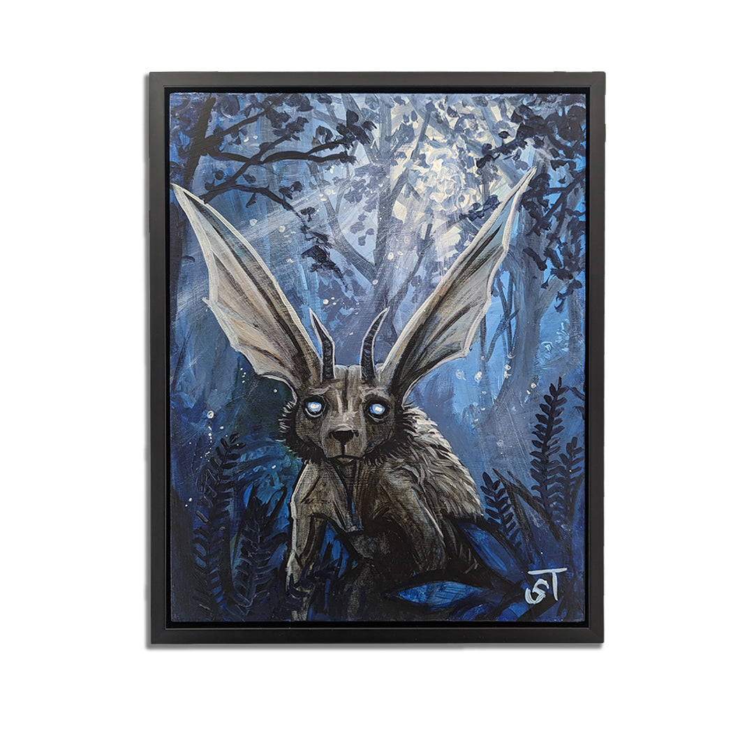 An acrylic painting on wood panel featuring a Chupacabra in a forest setting with a black frame.